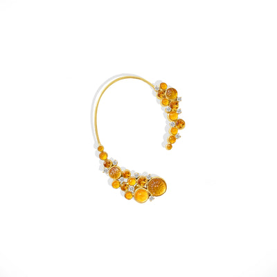 A single Citrine statement earcuff earring in yellow gold with Diamond detailing