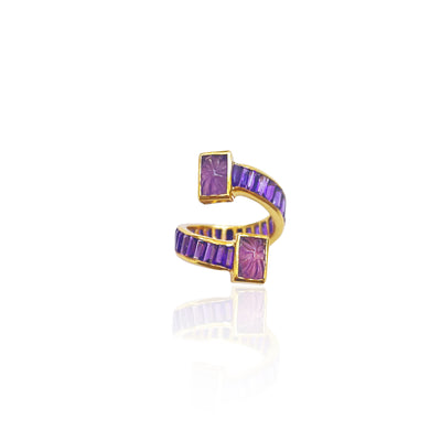 Purple Amethyst wrap around ring designed with faceted Amethysts on the band and hand carved Amethysts at the top and bottom of the ring.